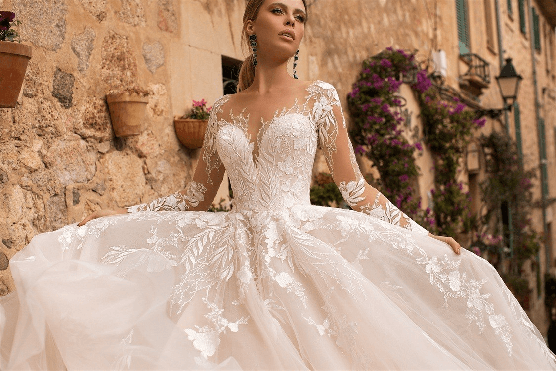 Long sleeve lace wedding dress with train