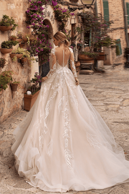 Long sleeve lace wedding dress with train